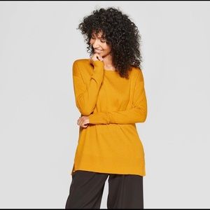 “A New Day” gold sweater